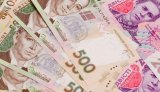 НБУ на 14 грудня послабив курс гривні до 27,27 грн/долар