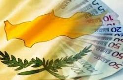 Cyprus banks reopen with limits on transactions