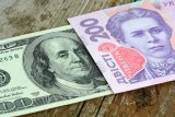 Официальный курс гривны установлен на уровне 26,42 грн/доллар