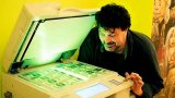 Киянин намагався розплатитися в банку за купівлю авто відксереними гривнями